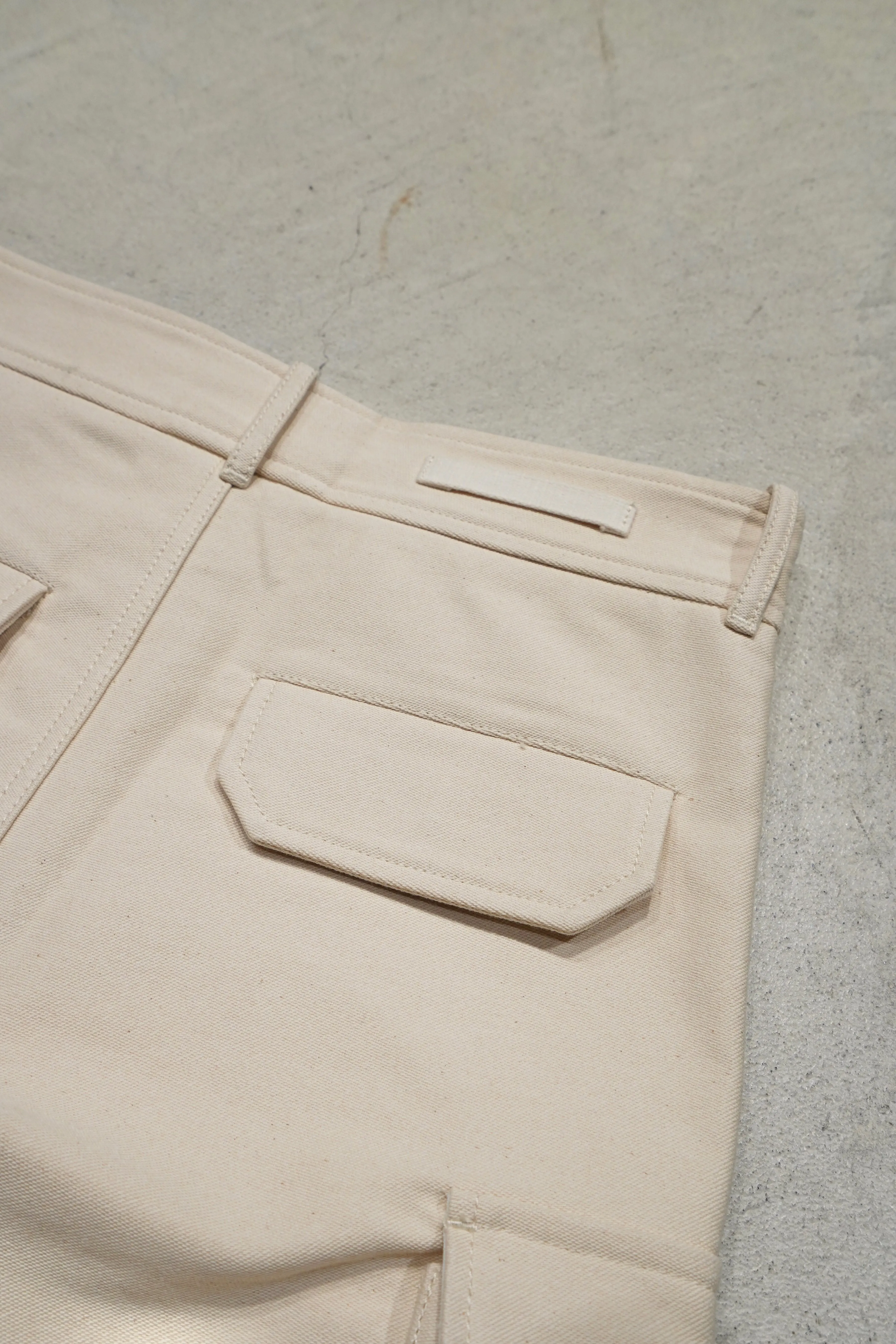 UNIFORME STITCH-DETAIL FLAP-POCKET TROUSERS