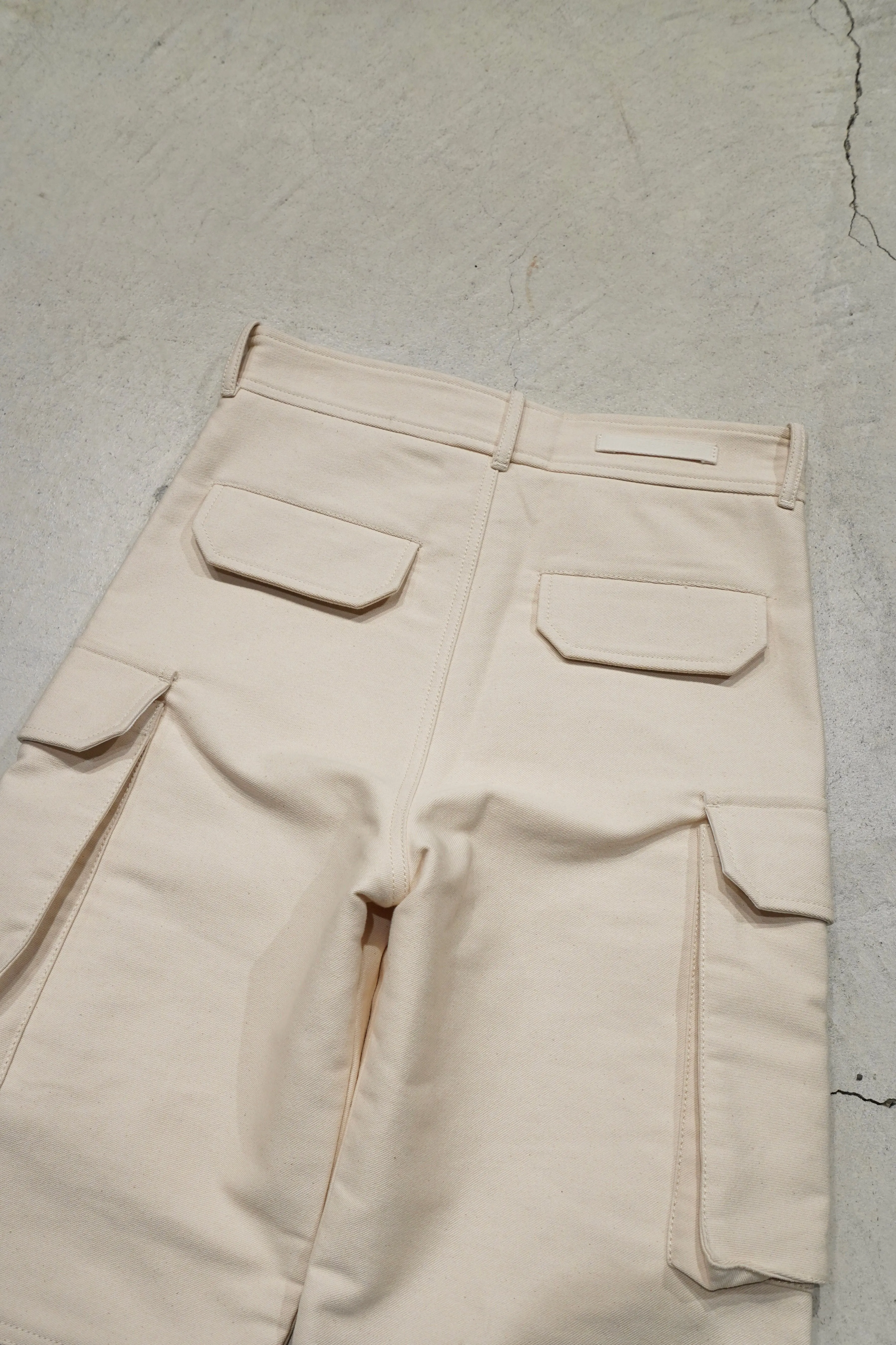 UNIFORME STITCH-DETAIL FLAP-POCKET TROUSERS